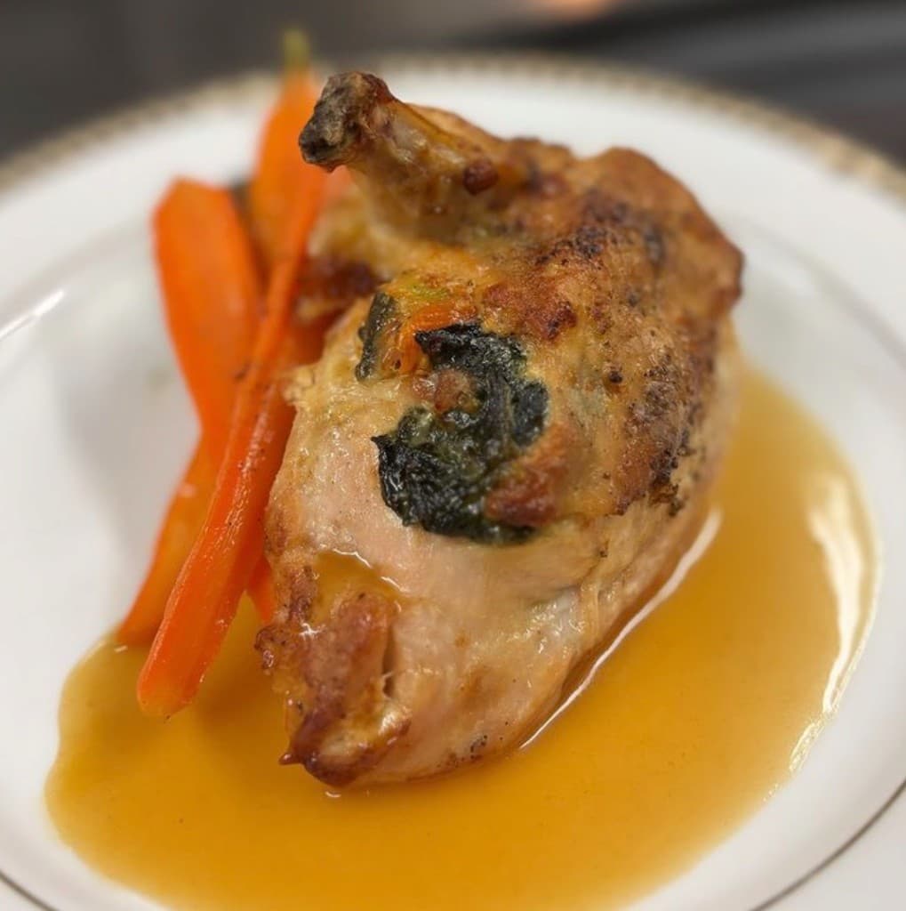 Stuffed chicken with roasted carrots